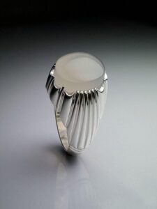 A men's ring with a distinctive engraving.